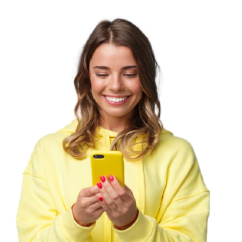 A photo of a woman holding cellphone while smiling.