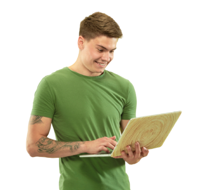 Photo of a man holding laptop while smiling.